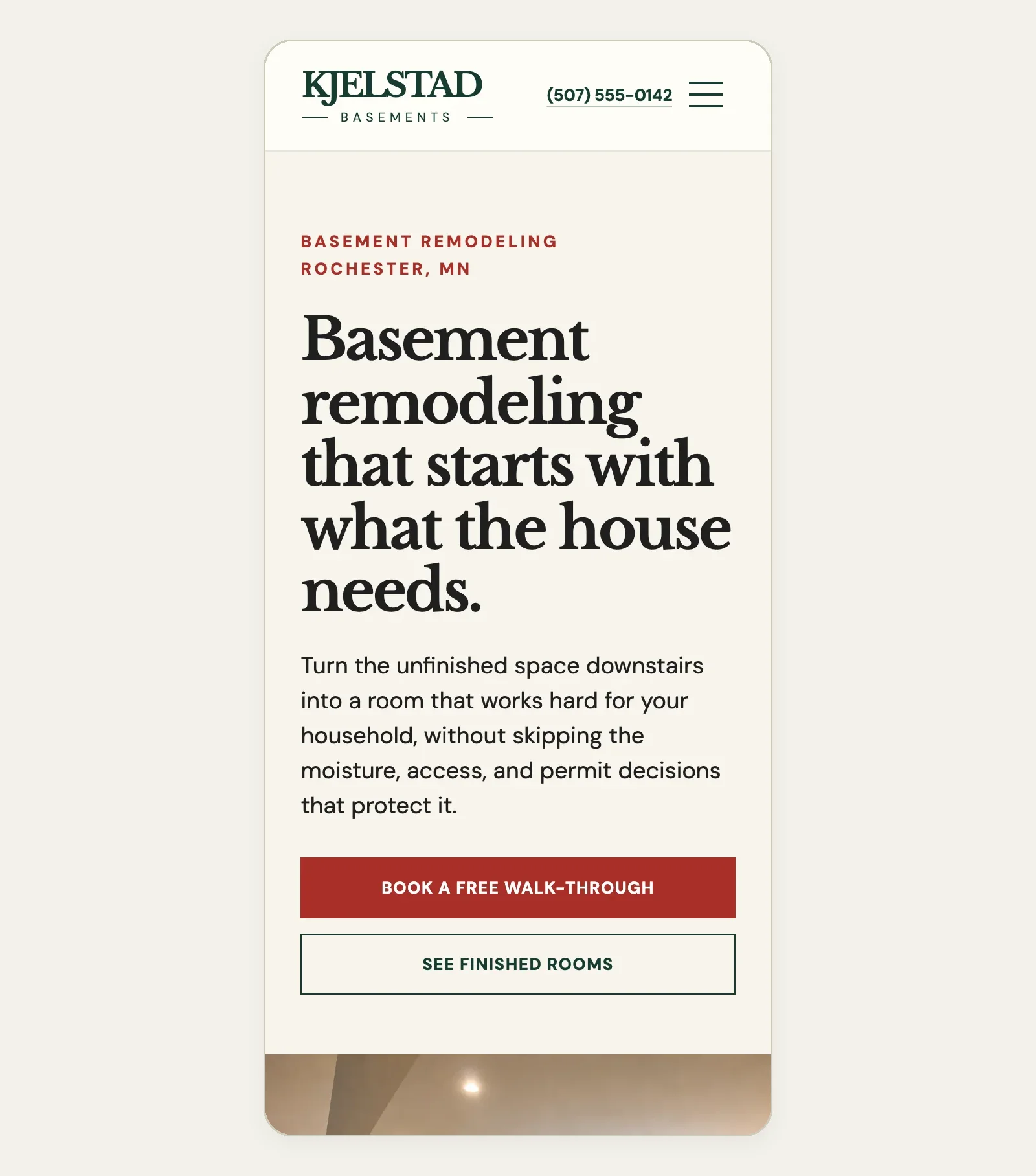 Kjelstad Basements Basement Remodeling in Rochester, MN page on a phone, built by Theo: the phone number in the header, the city above the headline and a Book a free walk-through button